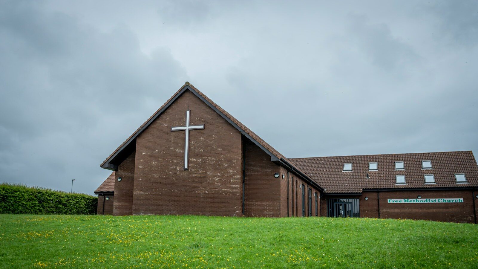 a church with a cross on the front of it